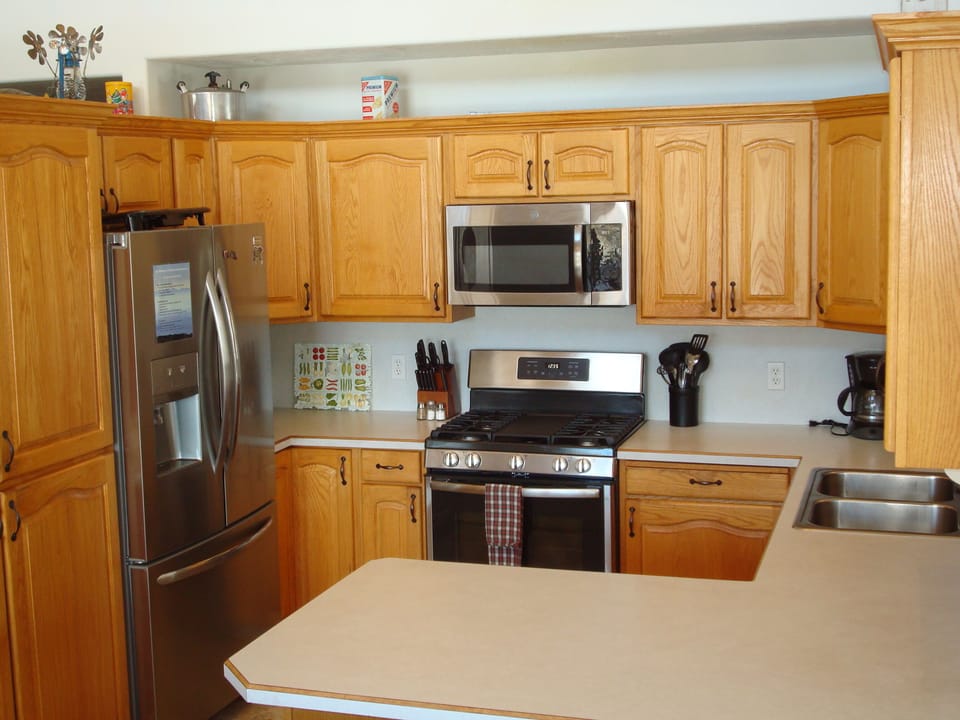 The kitchen has a stainless fridge & gas range, plus space for all your goodies!