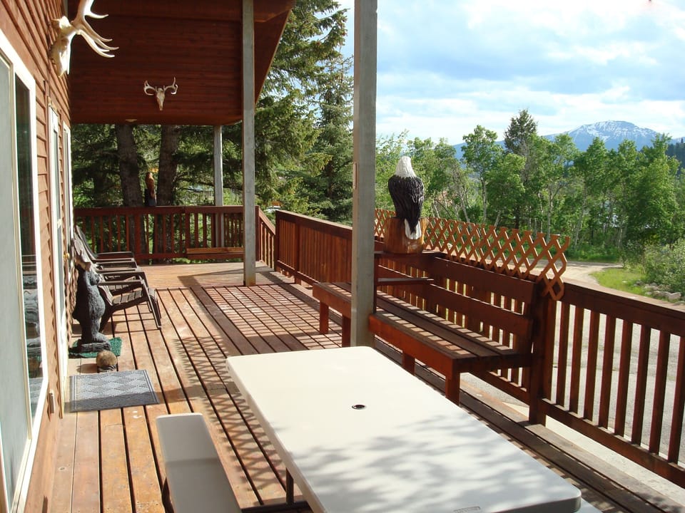 You'll enjoy panoramic mountain views while relaxing on the wrap around deck.