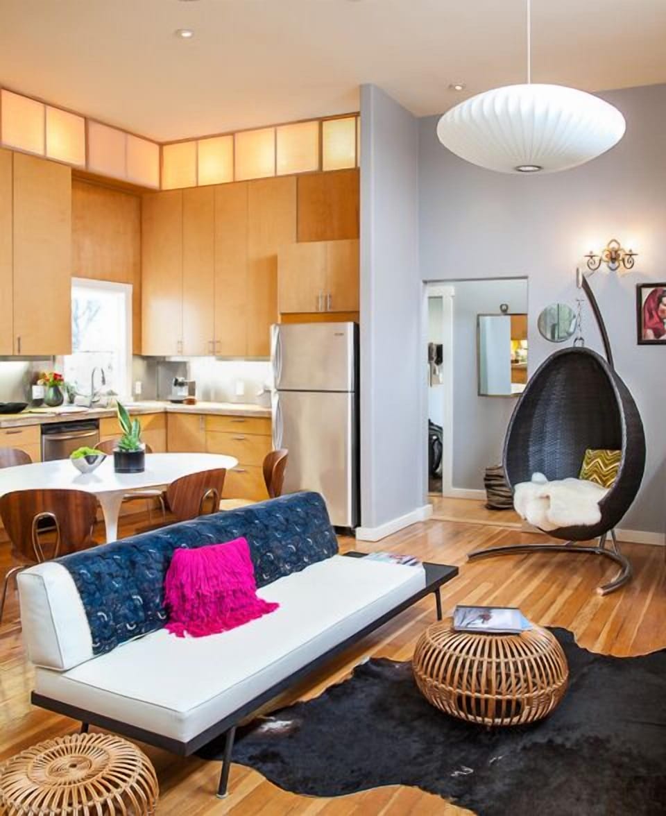 Living room with 12' ceilings. A mix of vintage and modern. furnishings.