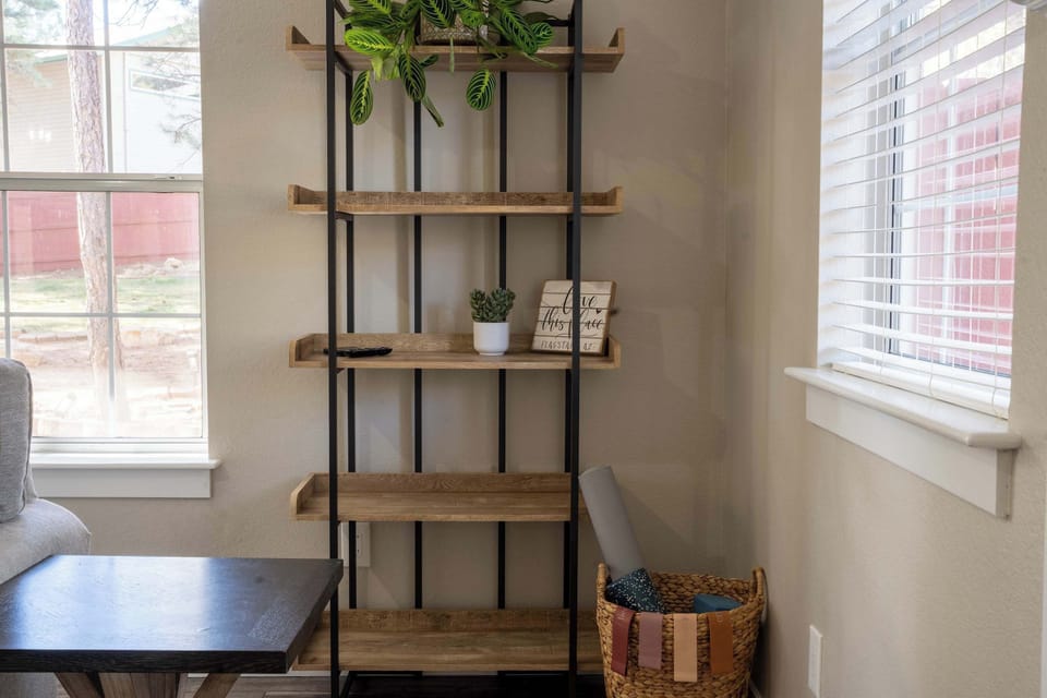 A simple wellness basket with a yoga mat, block, foam roller, and resistance bands — perfect for stretching, movement, or a mindful moment during your stay.