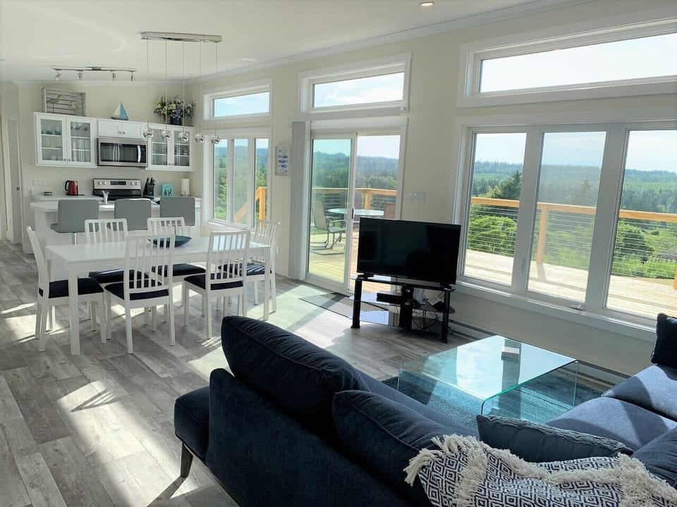 The open-concept living area  is great for entertaining and is flooded with natural light