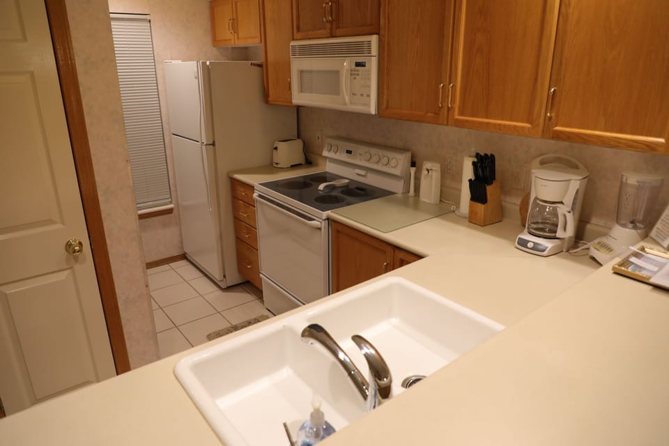 Kitchen with glass top range and oven