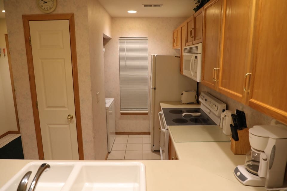 Kitchen with toaster, can opener, coffee maker, crock pot, blender, mixer, etc..