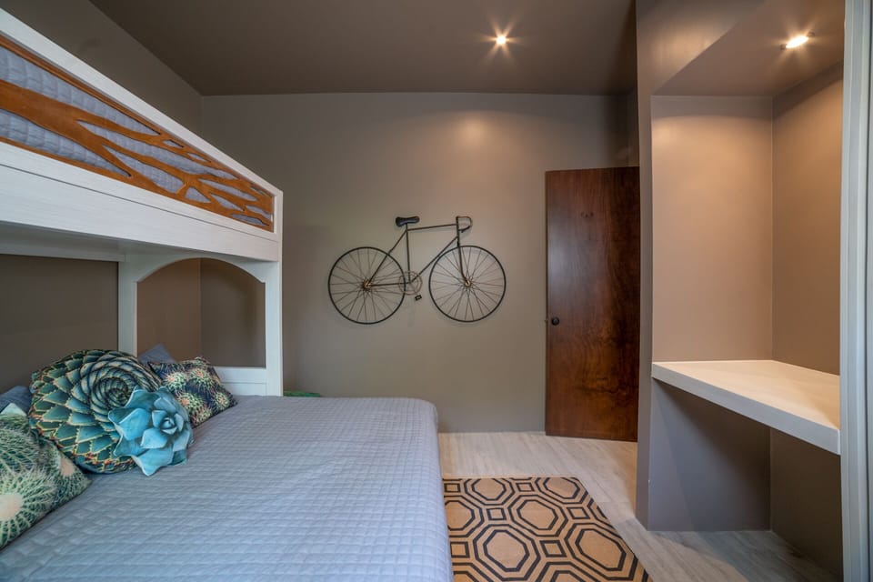 #4 The bunk arrangement adds a playful touch to the room, perfect for the young at heart or those seeking a unique sleeping experience.