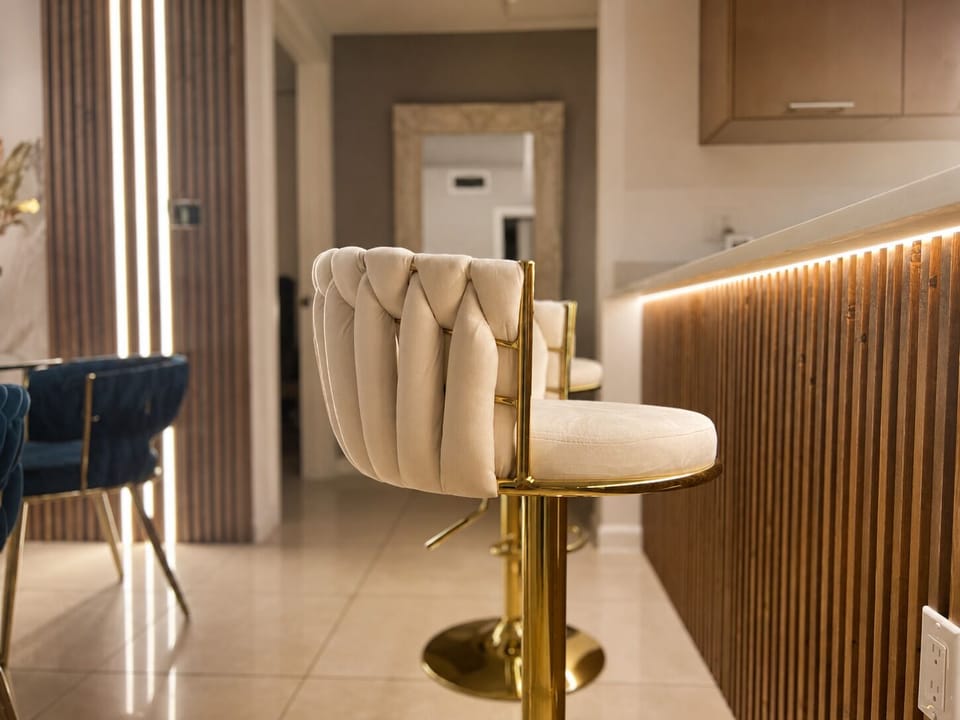 Elegant breakfast bar with plush seating and warm ambient lighting