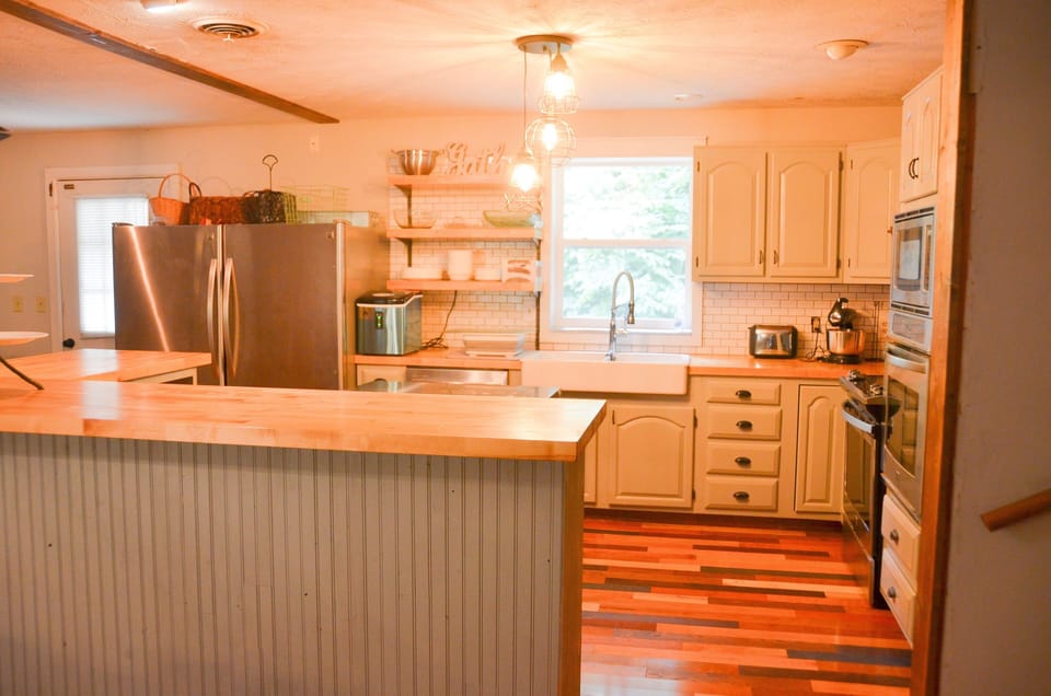 Kitchen has 2 refrigerators and 2 ovens