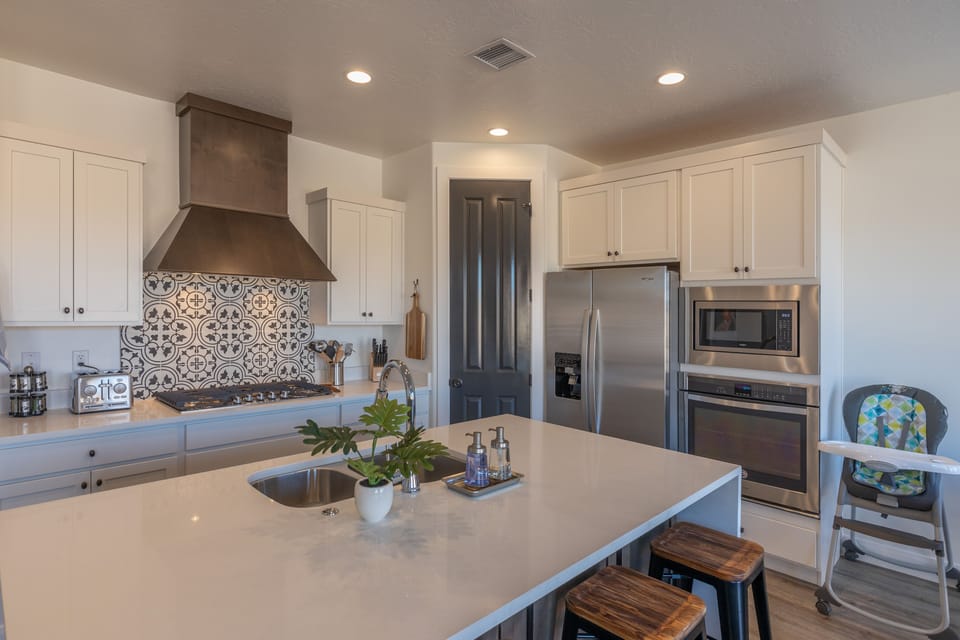 Kitchen - The Kitchen is complete with everything you will need for meal preparations including pots, pans, baking dishes, plates, cups, silverware, cutlery, and an assortment of cooking utensils.