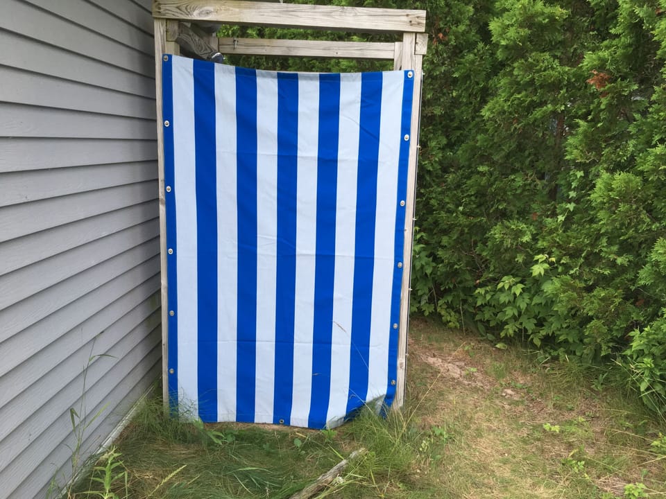Outdoor shower with curtain