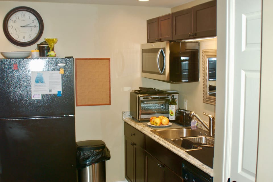 Full size fridge with ice maker. Dishwasher next to pantry.