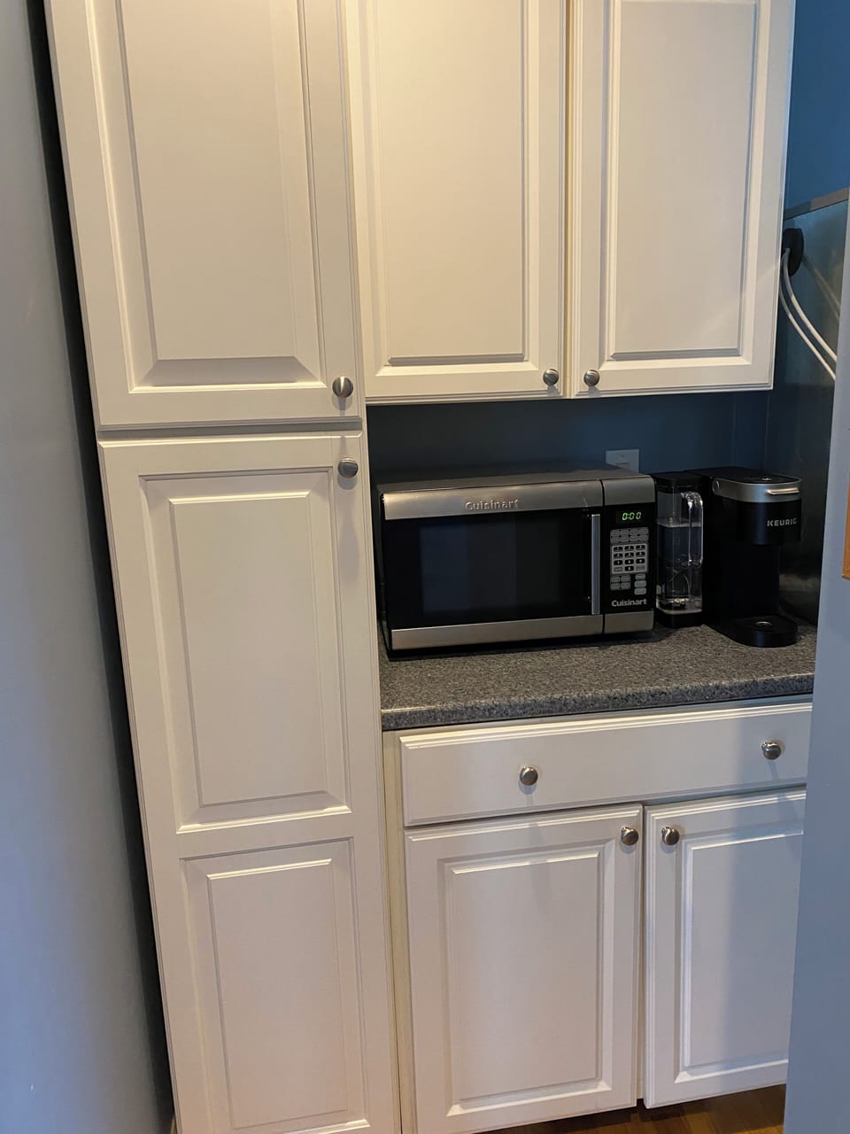 Tall pantry cabinet and additional storage in kitchen