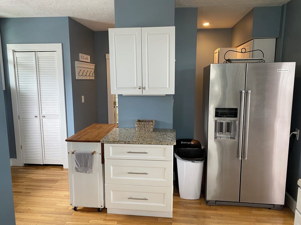 Fully stocked pot drawers, kitchen cart and pantry closet