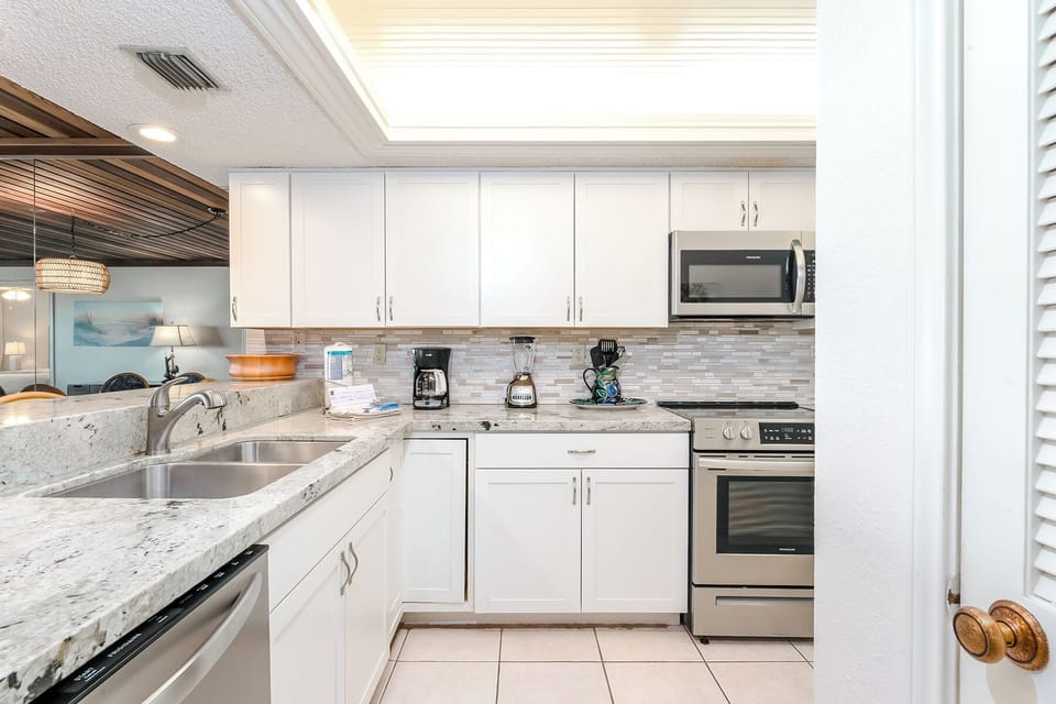 Get ready to stir up some fun and make your taste buds dance like no one's watching in this fully equipped kitchen with a view!