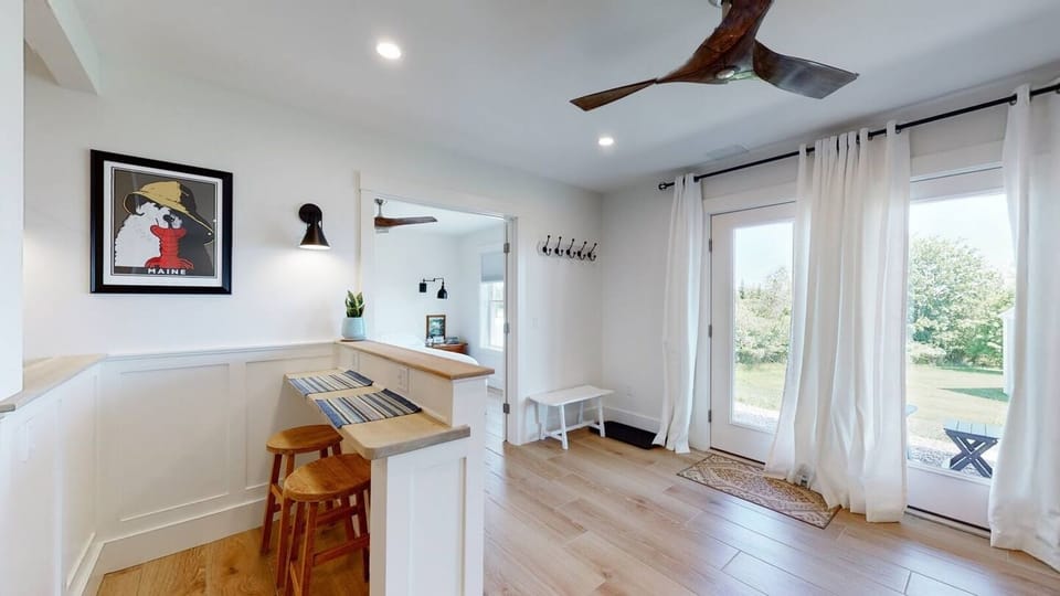 BSMT: Enjoy your morning coffee and the view!  French doors to the backyard, complete with Adirondack chairs for your morning coffee.