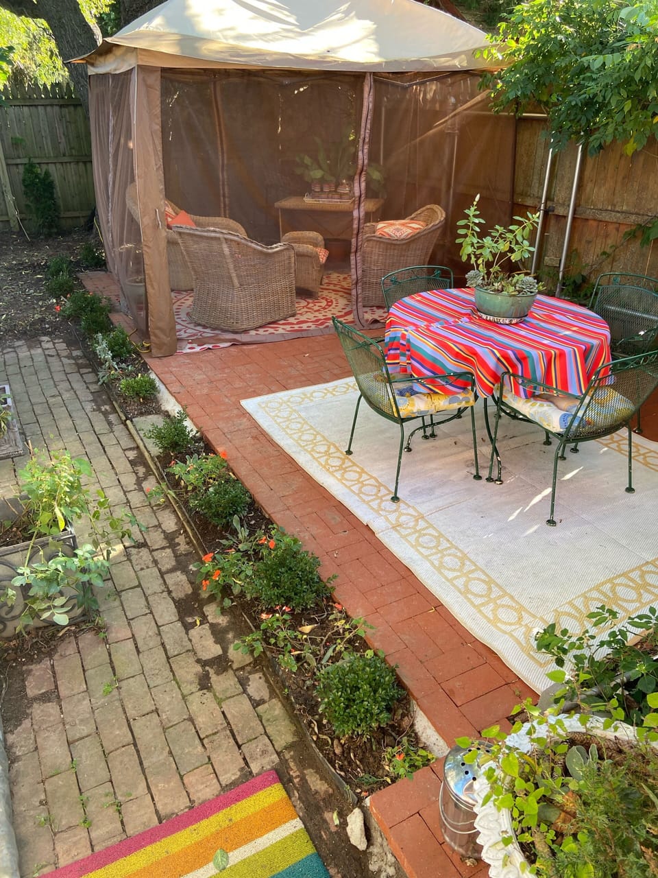 The wisteria terrace off of the den is lovely for breakfast, reading or yoga. 