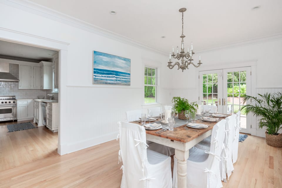 Large Dining Area that Opens to Brick Terraces and the Pool Area