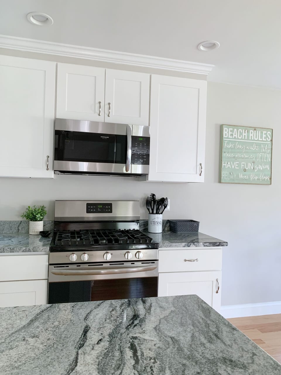 Microwave, gas stove/oven, refrigerator kitchen island 