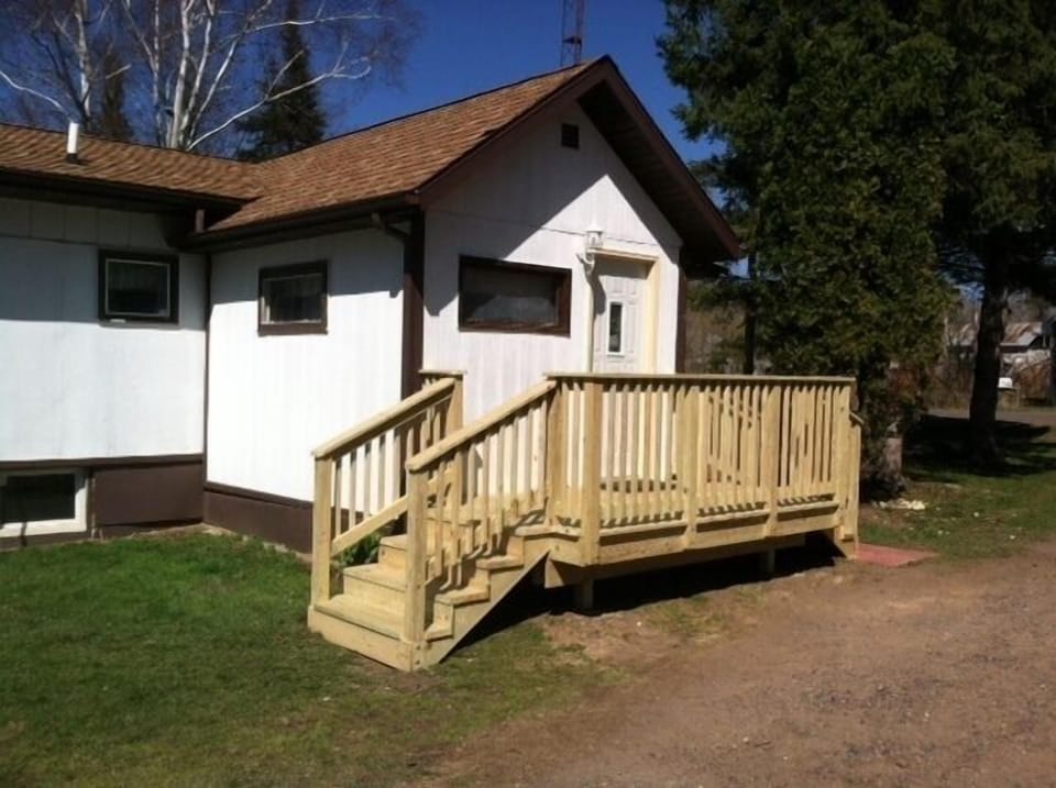 Enter on a front deck into an entryway. Continue to main floor or lower level.
