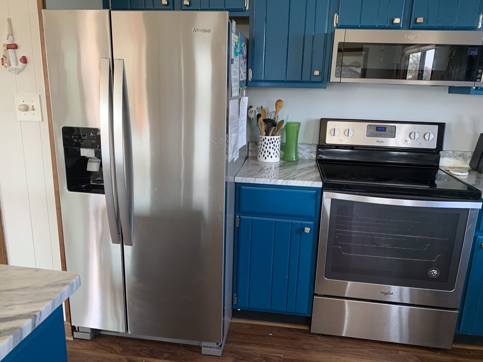 open kitchen with stainless steel appliances and beautiful granite countertops 