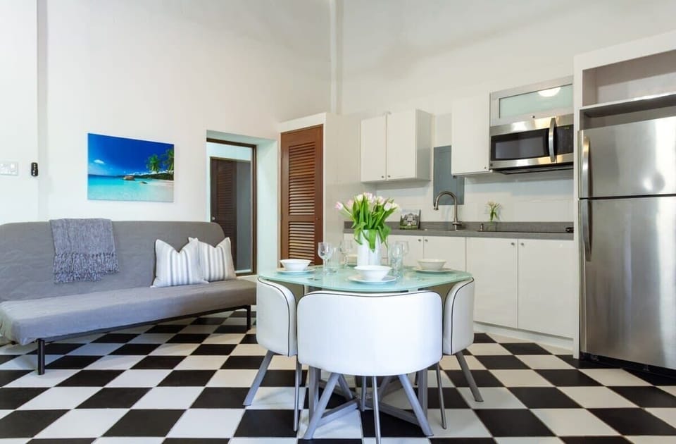Living room, dining table and kitchen