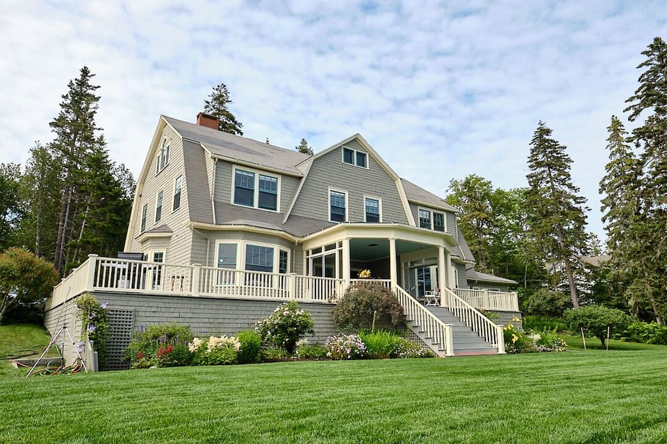 Stunning 1903 updated home on Frenchman Bay with a huge yard & wrap around deck