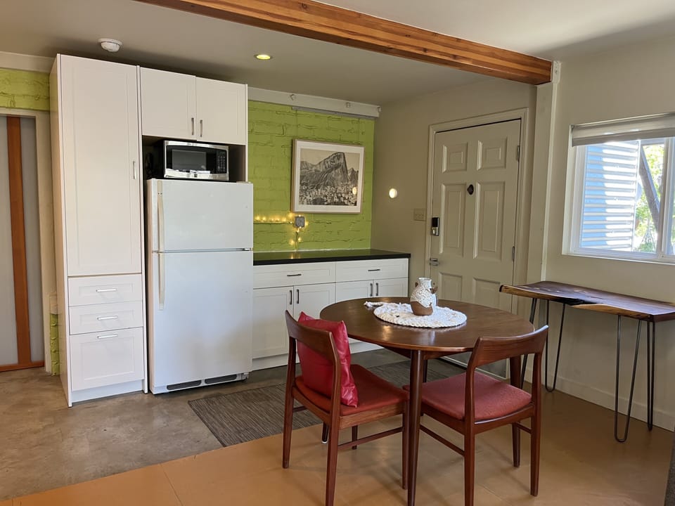 Main entrance to kitchen with Danish modern dining table.