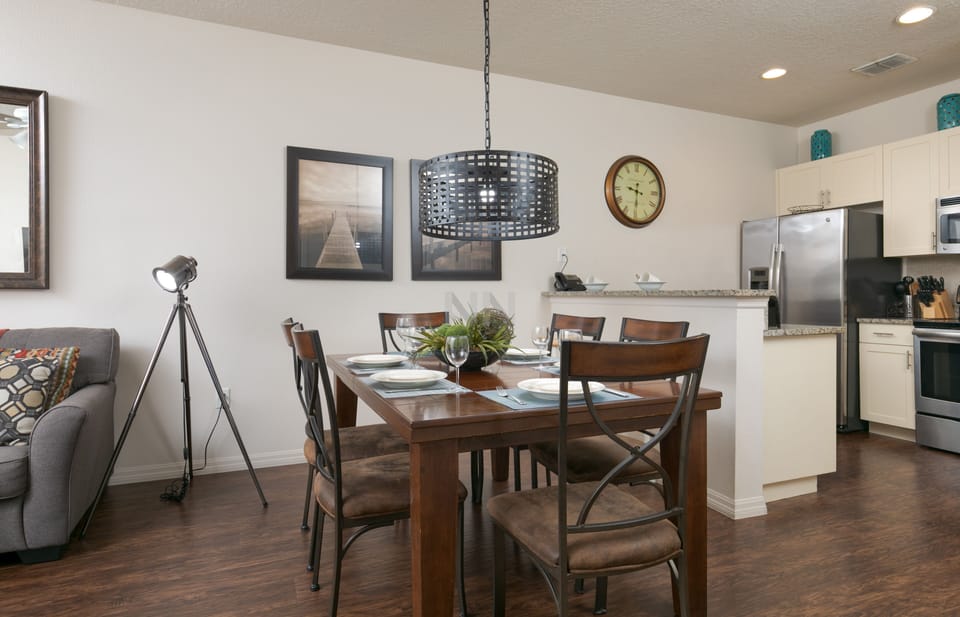 Seamlessly integrated living room with a stylish dining table for shared meals.