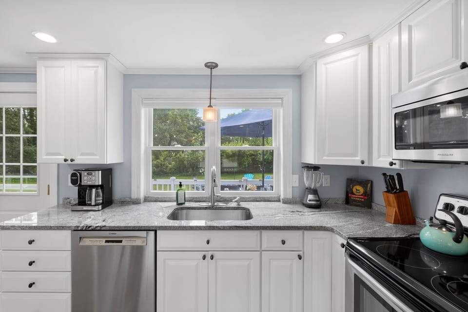 Bright, modern kitchen fully stocked.