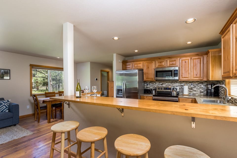 Bar, kitchen, and dining area