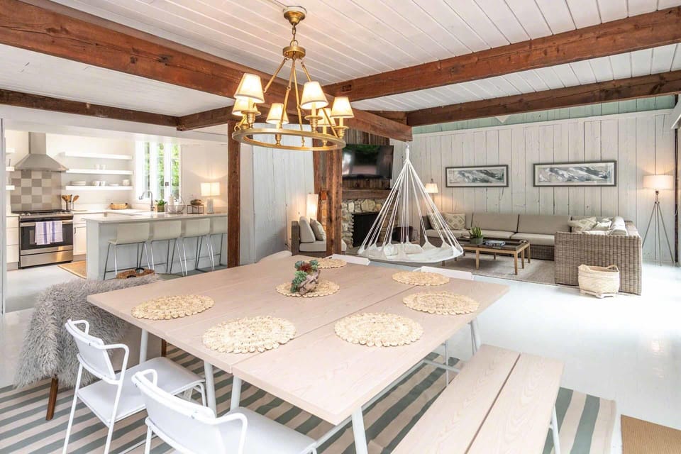 Large Dining Table Overlooks Living Area and Kitchen