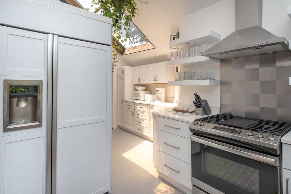 Kitchen Has Plenty of Counter Space and Vaulted Ceilings with Large Skylight
