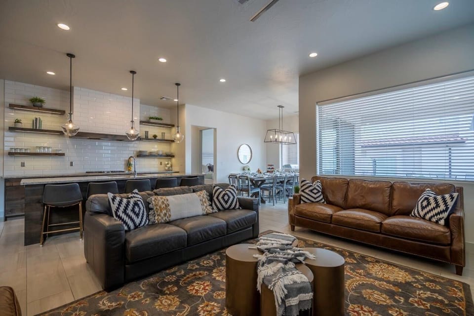 Main floor living room with a PS4, fireplace, and comfortable sofas