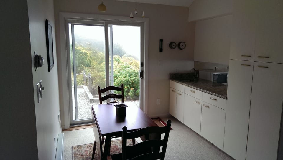 Breakfast nook with sliders to outdoor dining area