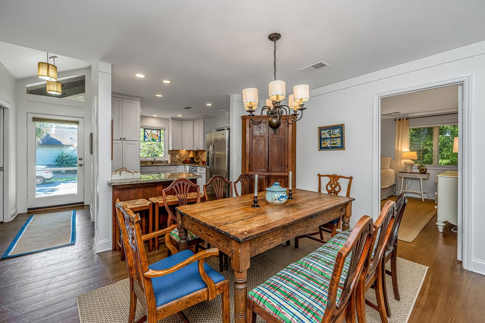 Cottage entrance, kitchen, dining area, and main bedroom