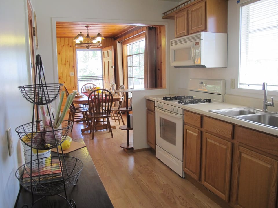 Main house kitchen, fully stocked with cookware and dishware