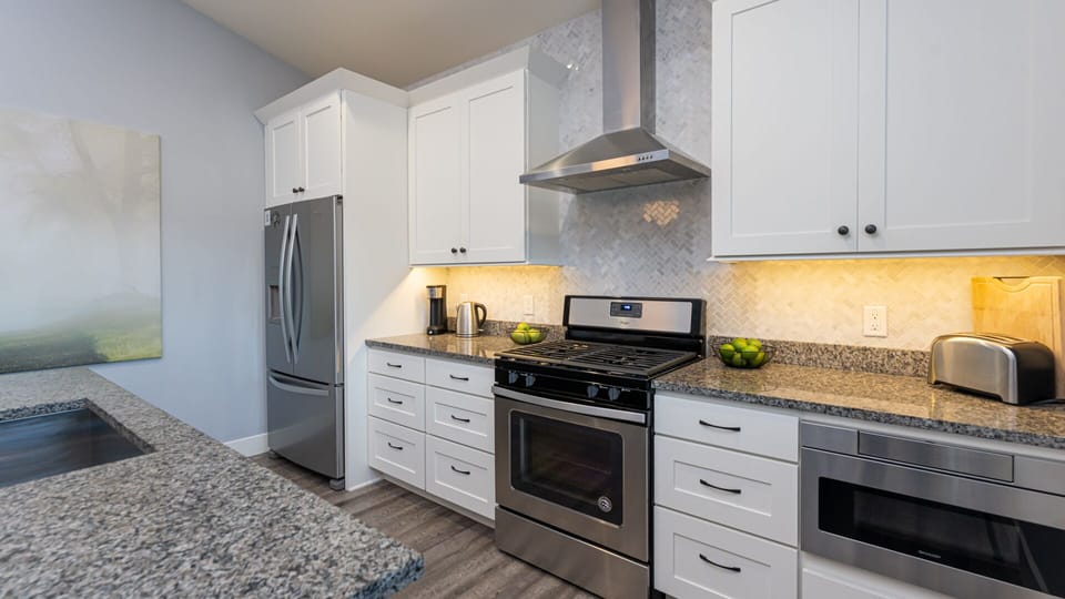 Kitchen equipped with stainless steel appliances.