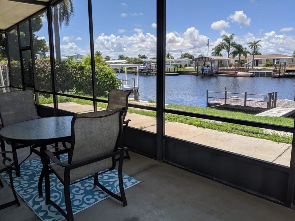 outdoor dining in the screened in lanai