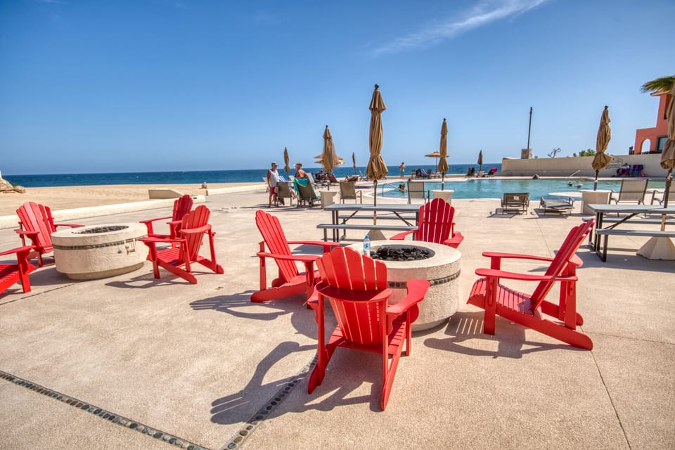 Ocean side pool, nighttime firepits