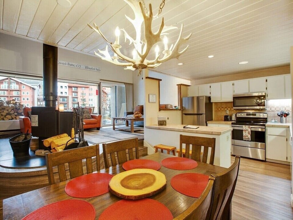 Dining room with open kitchen and living room