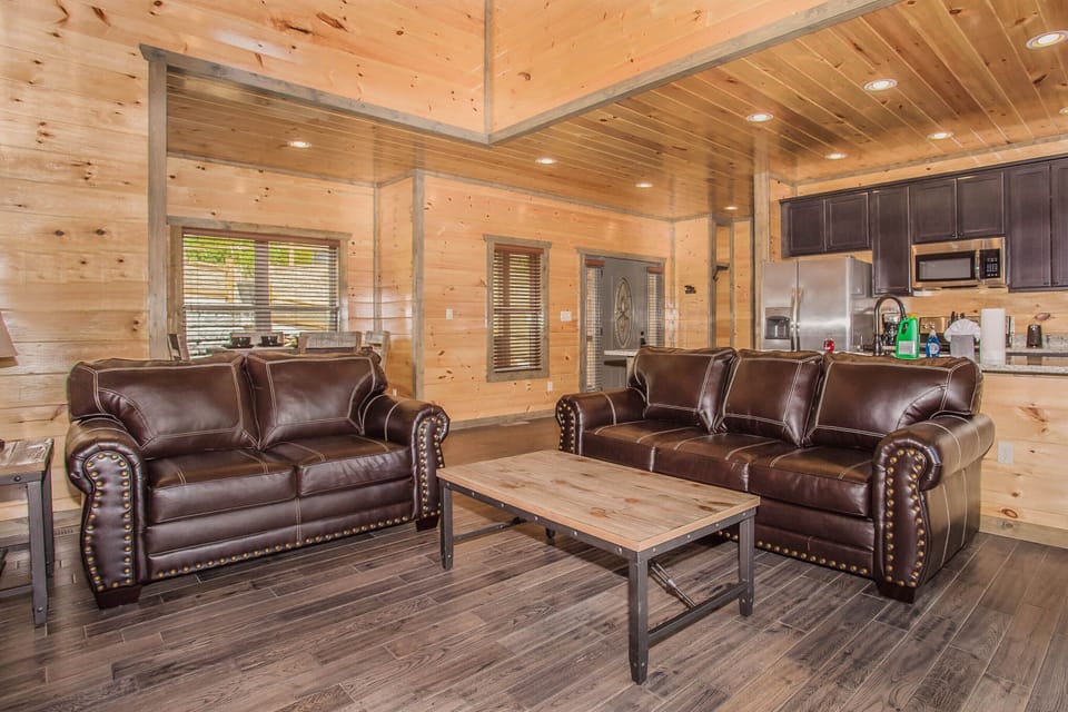 Main level living room with queen sleeper sofa.