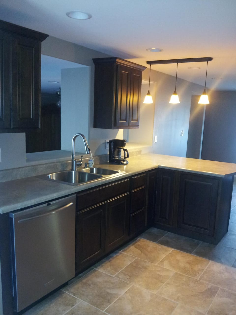 Well stocked kitchen with stainless steel appliances.