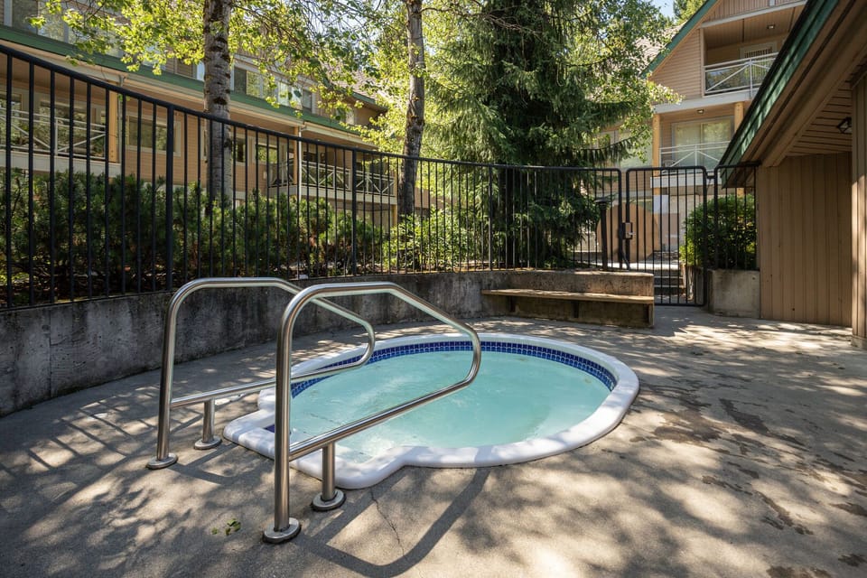 Soak under the stars in the shared hot tub just steps from your patio.