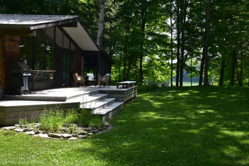 South facing deck overlooking Black River and private grounds and garden. 