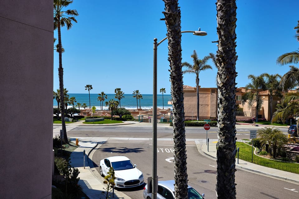 infront of balcony/side street on Sportfisher side