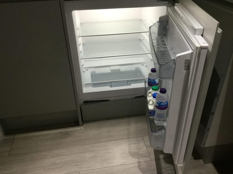 Refrigerator stocked with water and milk 
