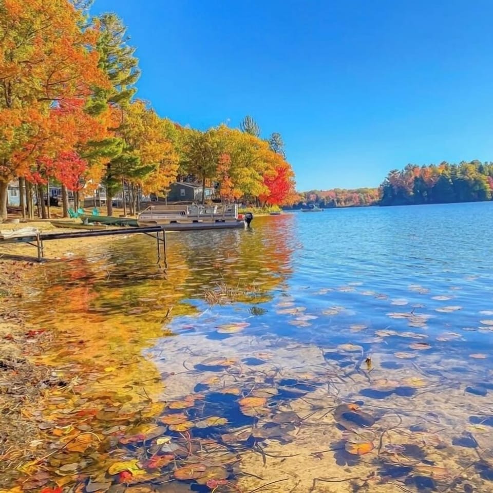 Crisp autumn day on Bass Lake photographed from beach at Whitetail Cottage.