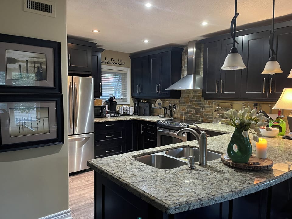 Open kitchen with counter barstools - great for entertaining