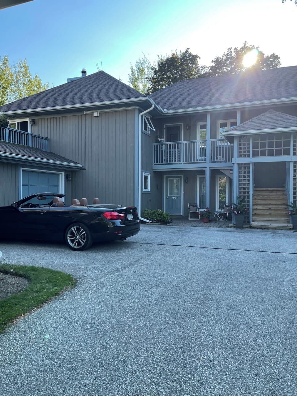 Rental unit is top floor left of stair. The unit's garage is at car