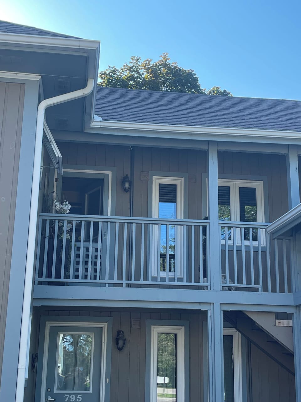 Front entrance complete with screen door and metal door and sidelight 