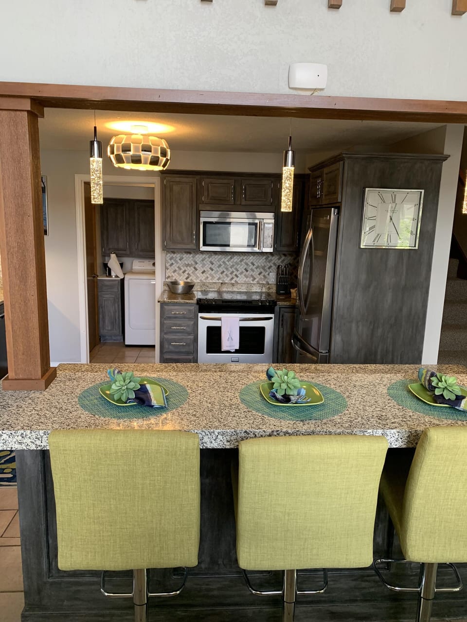 Eat-in kitchen with pass through and barstools