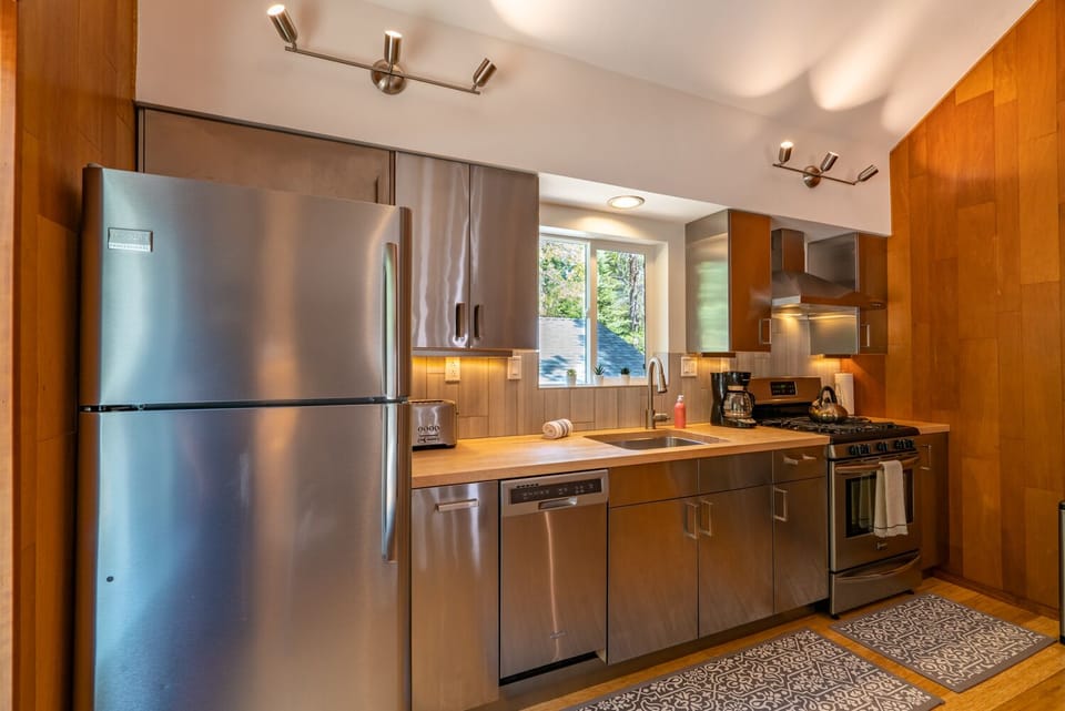 Stainless Steel Appliances and Cabinets. Breville toaster and dishwasher.